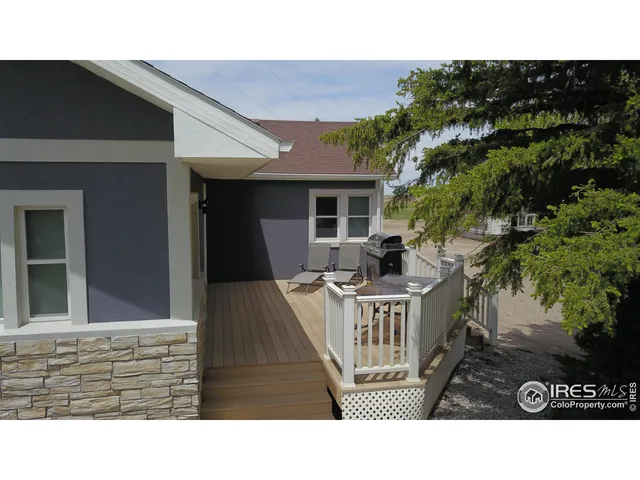 a view of outdoor space with deck area and patio