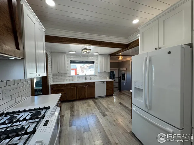 a large bathroom with a large tub and sink