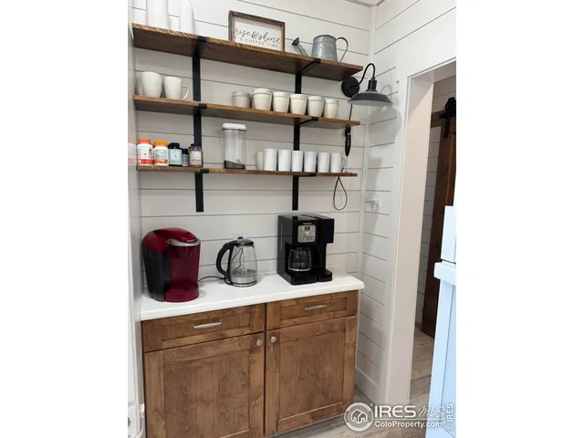 a kitchen with refrigerator and window