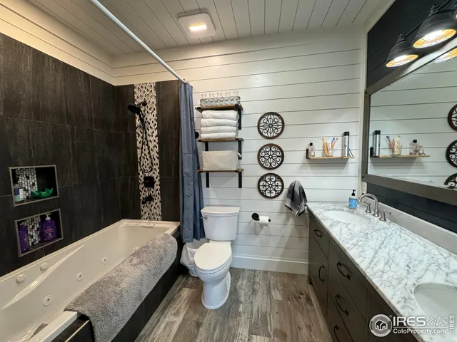 a living room with a couch and a chandelier