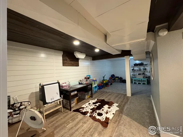 a bed room with a bed and a television