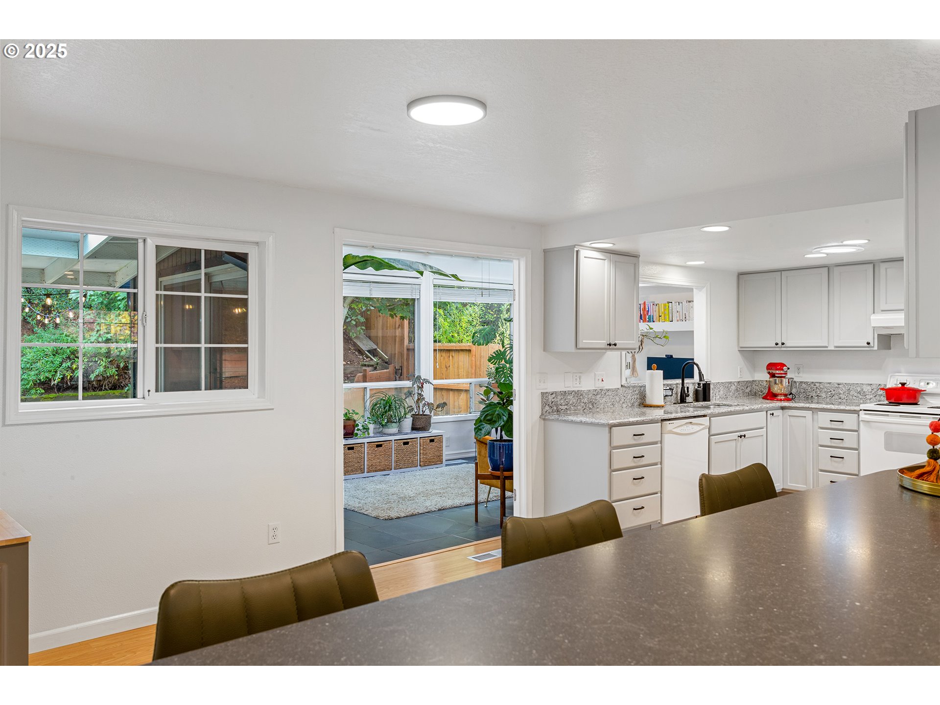 8405 Southwest Lori Way Beaverton, OR 97007 - Photo 13 of 48 a kitchen with cabinets and wooden floor