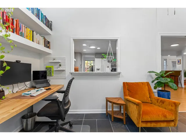 a workspace with furniture and a potted plant