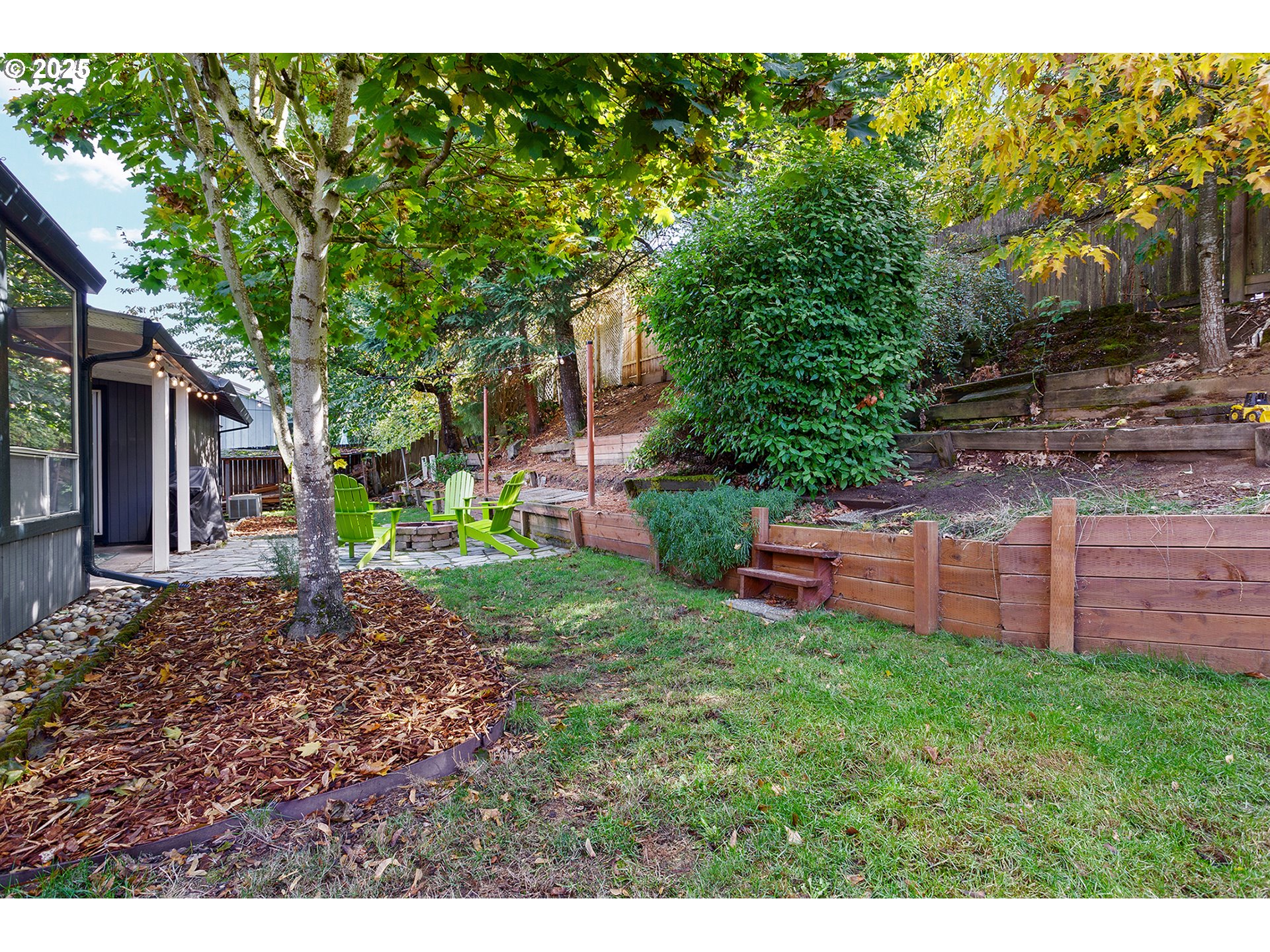 8405 Southwest Lori Way Beaverton, OR 97007 - Photo 37 of 48 a view of a backyard with plants and large tree