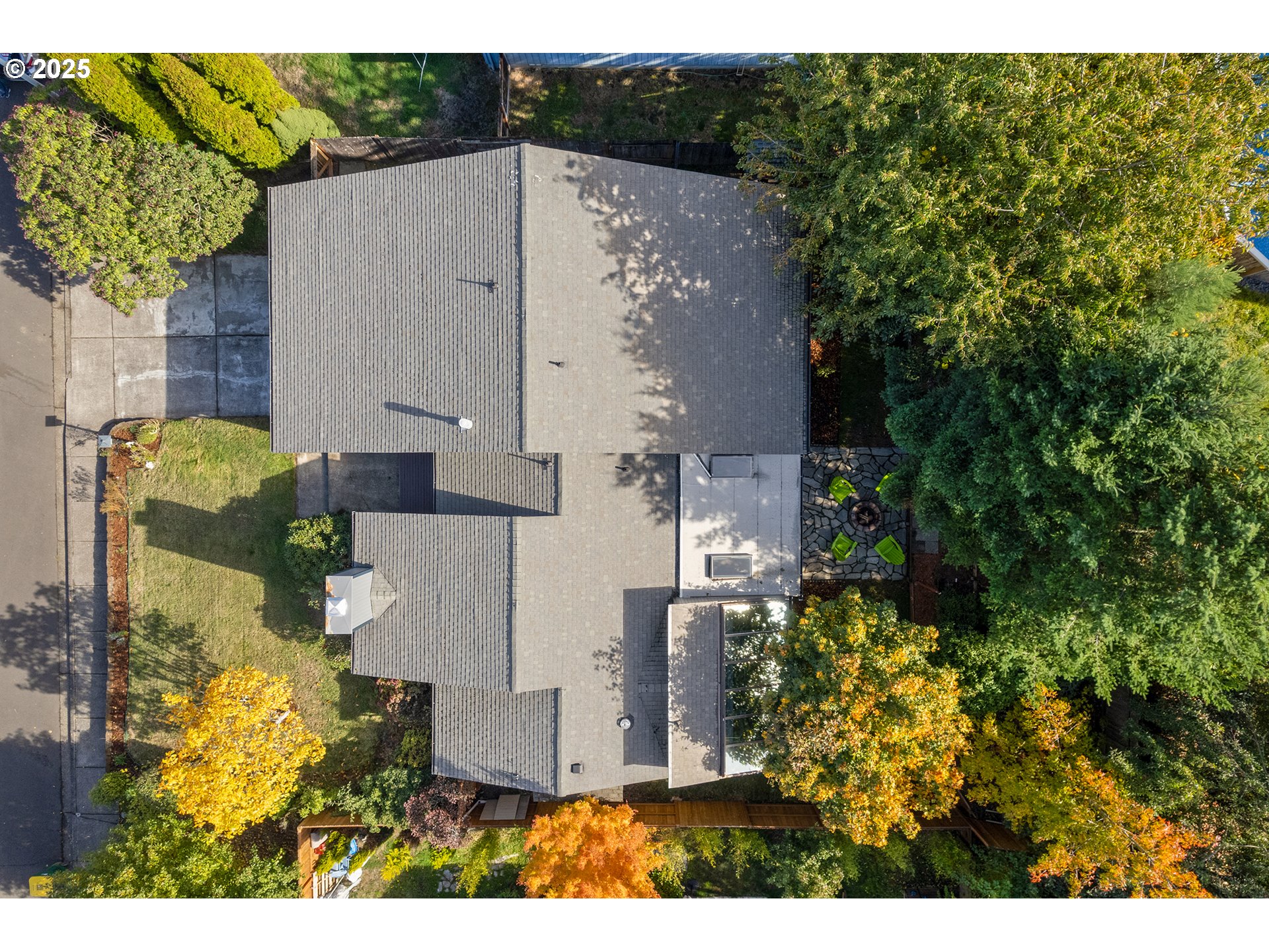 8405 Southwest Lori Way Beaverton, OR 97007 - Photo 4 of 48 an aerial view of a house with a yard and large trees