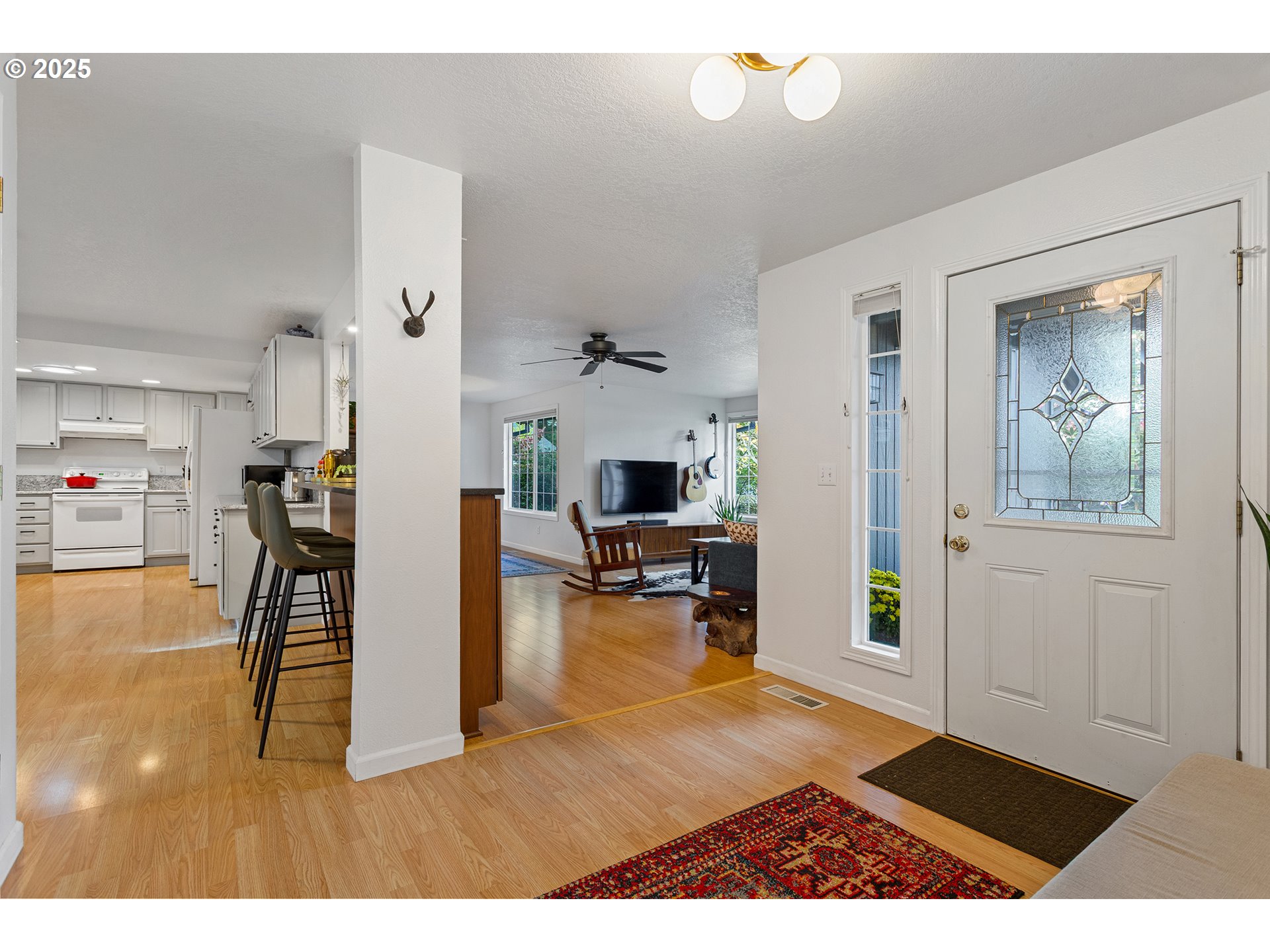 8405 Southwest Lori Way Beaverton, OR 97007 - Photo 7 of 48 a living room with furniture and a table