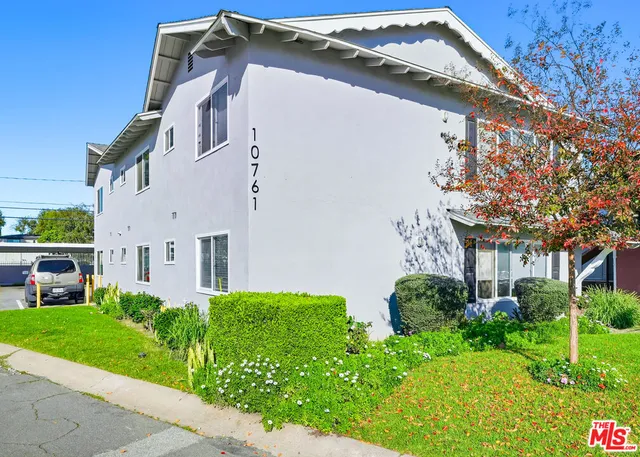 a house view with a garden space