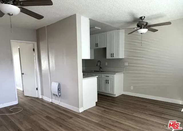 a view of a kitchen with a sink and dishwasher