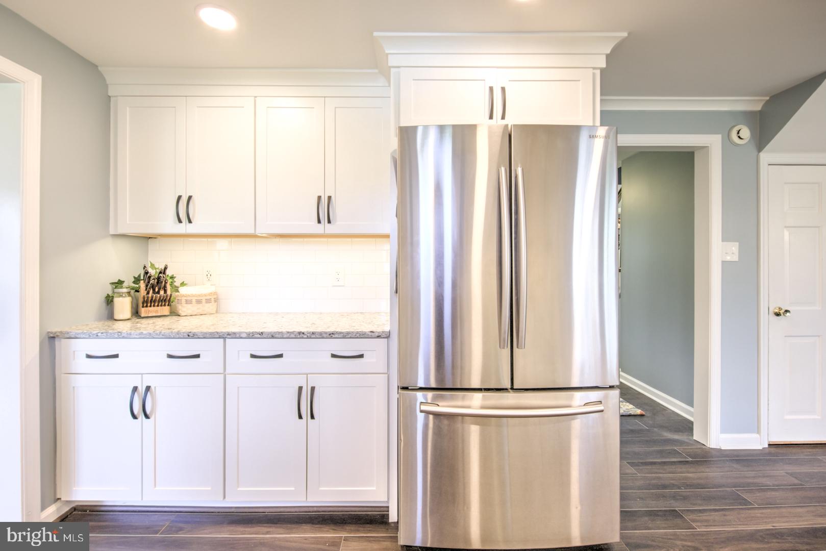 115 Diamond Rock Road Phoenixville, PA 19460 - Photo 11 of 33 a kitchen with stainless steel appliances a refrigerator and cabinets