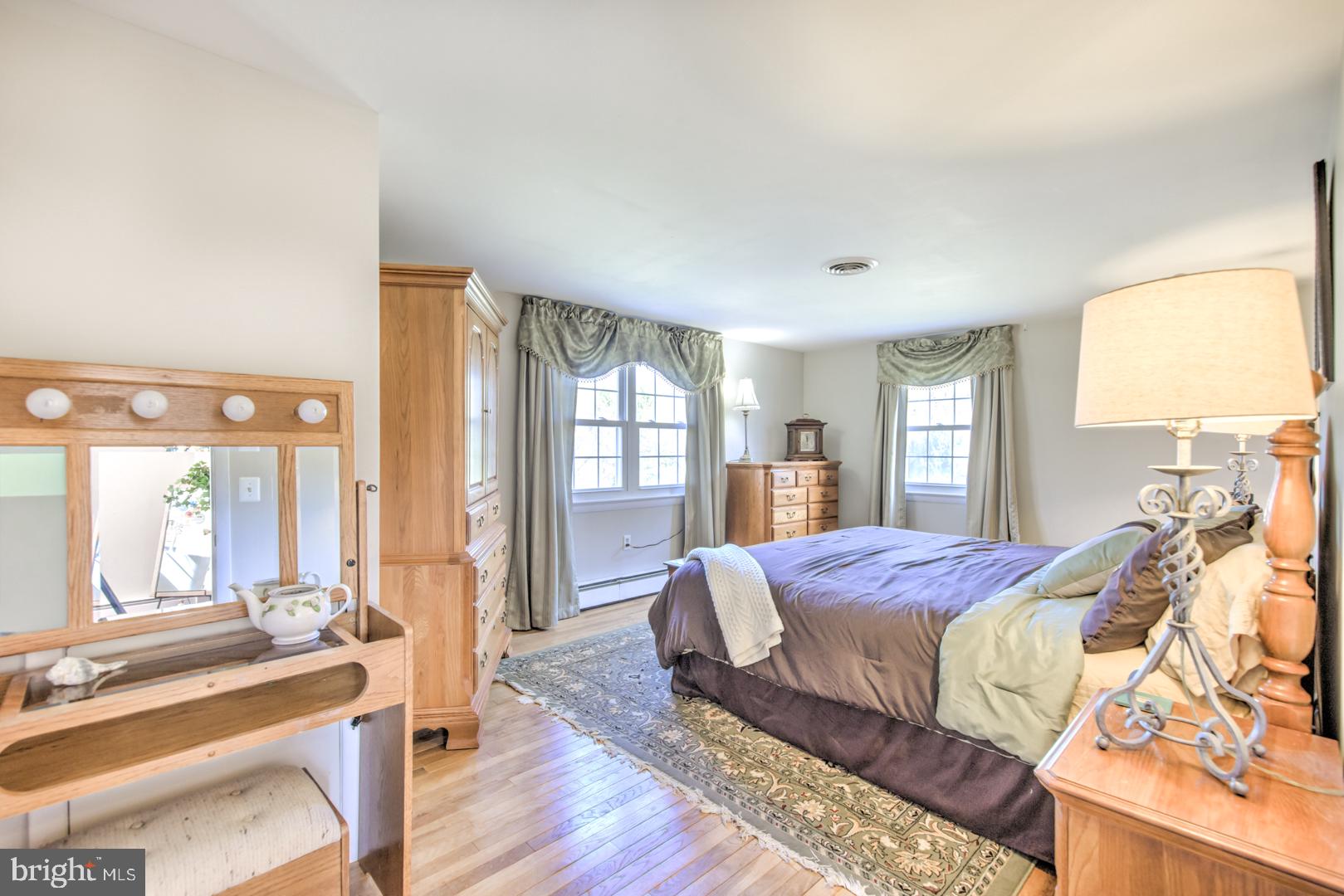 115 Diamond Rock Road Phoenixville, PA 19460 - Photo 25 of 33 a bedroom with a bed and a night stand