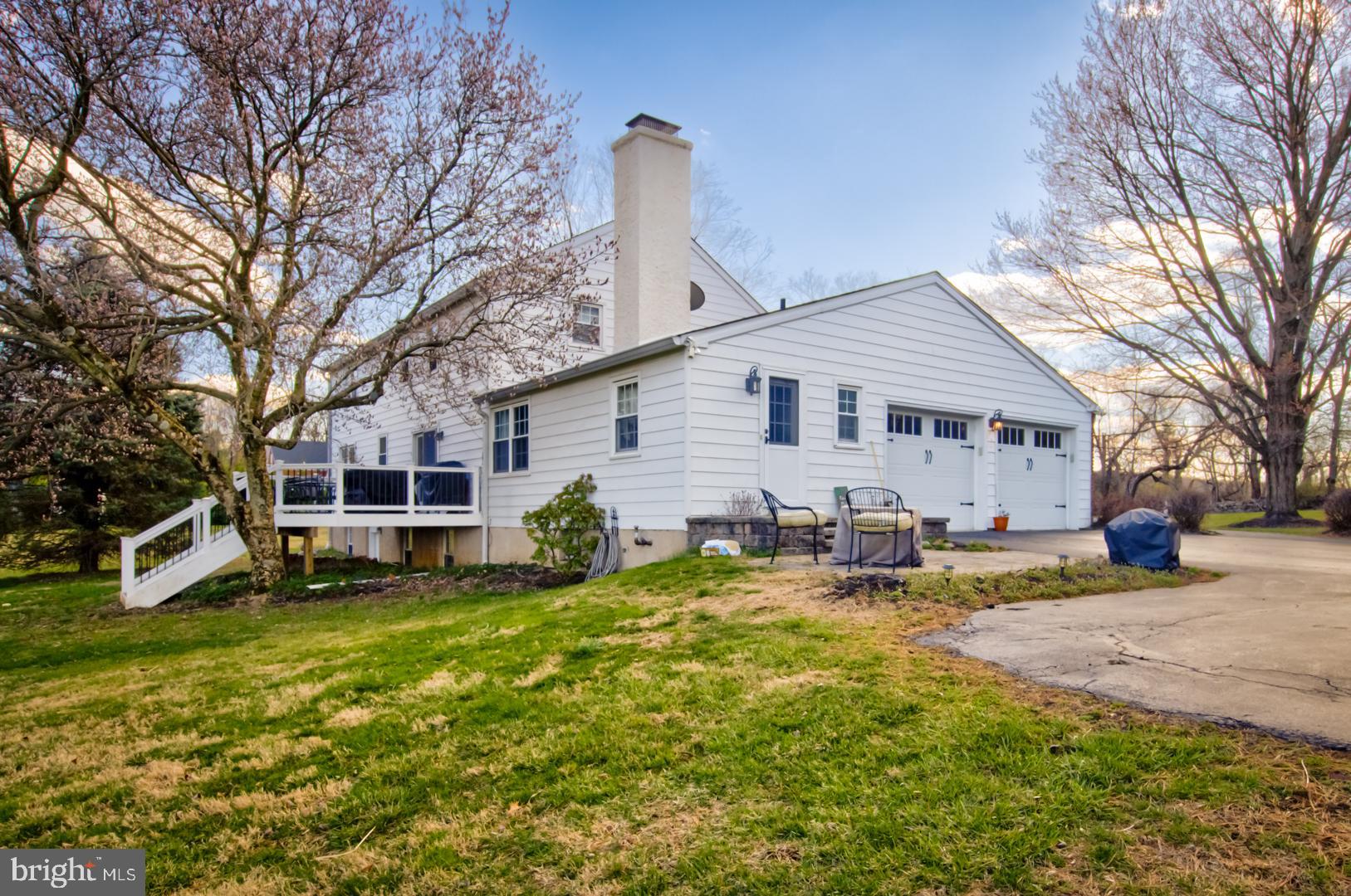 115 Diamond Rock Road Phoenixville, PA 19460 - Photo 3 of 33 a view of a house with a yard patio and fire pit