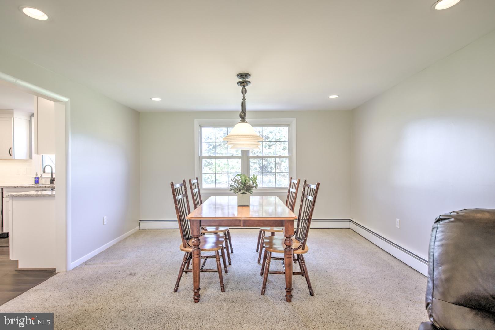 115 Diamond Rock Road Phoenixville, PA 19460 - Photo 9 of 33 a dining room with furniture a chandelier and window