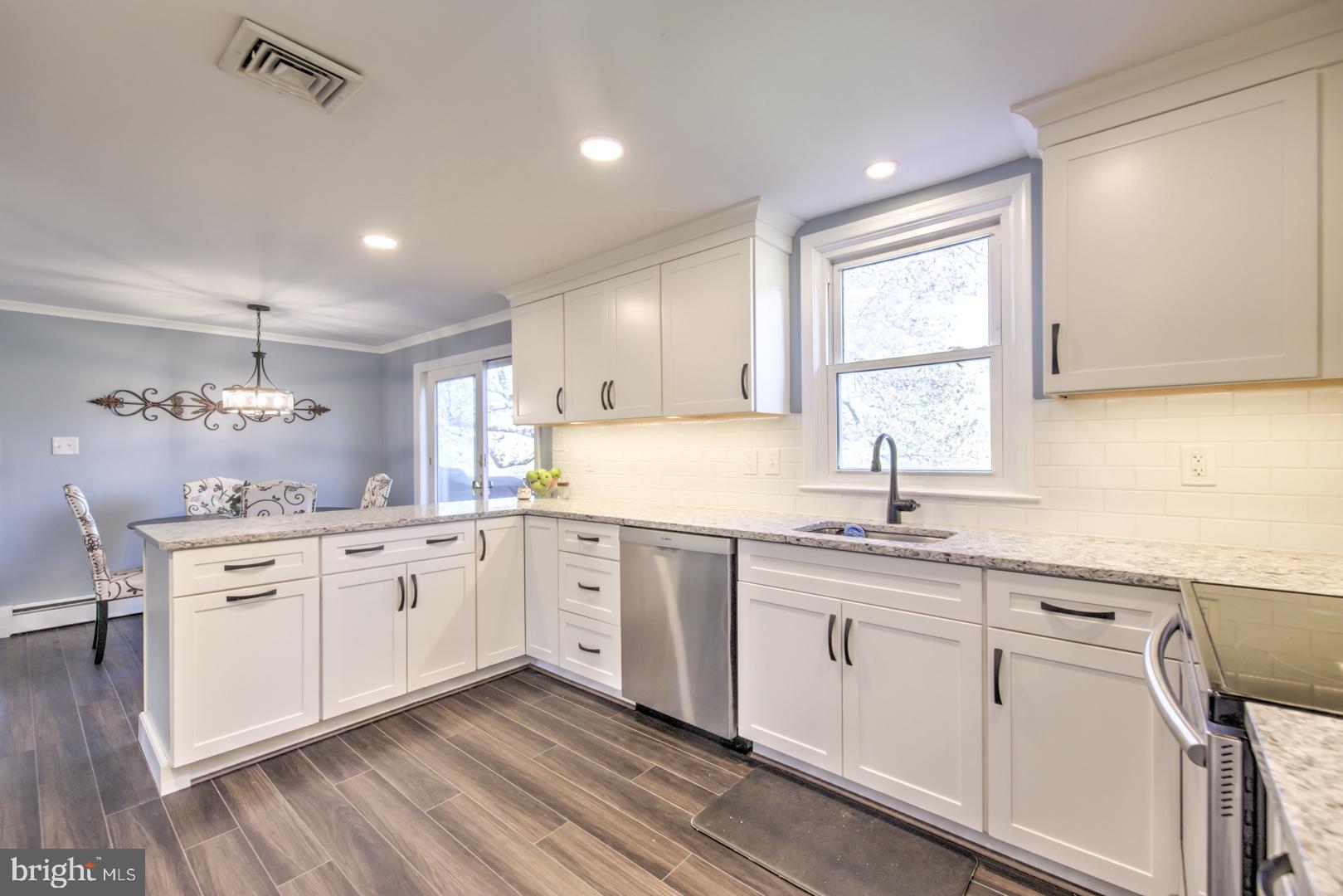 115 Diamond Rock Road Phoenixville, PA 19460 - Photo 10 of 33 a kitchen with granite countertop white cabinets and white appliances
