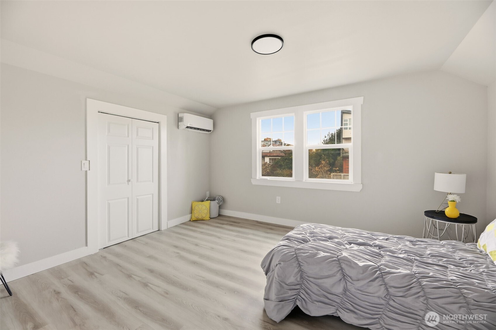 2813 15th Avenue South Seattle, WA 98144 - Photo 15 of 37 a bedroom with a bed and wooden floor