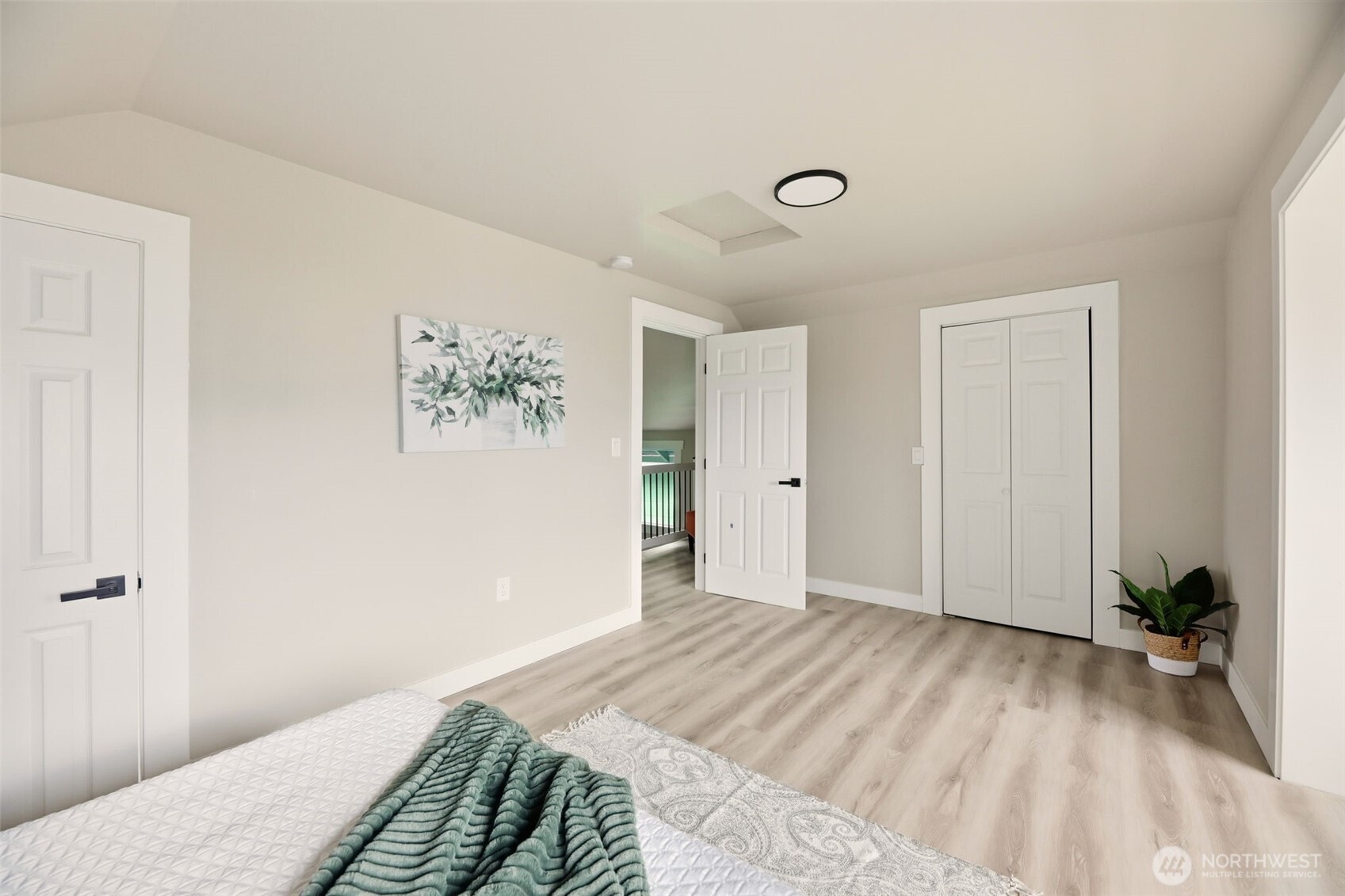 2813 15th Avenue South Seattle, WA 98144 - Photo 19 of 37 a bedroom with a bed and a painting on the wall