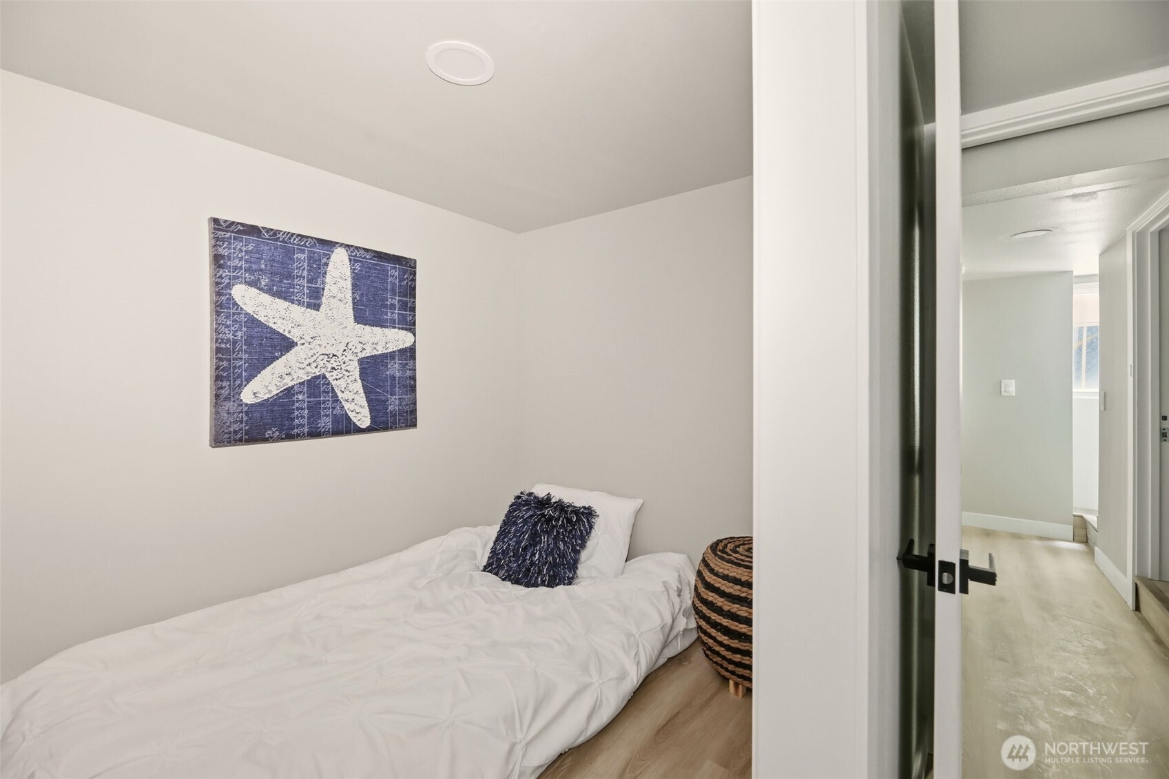 2813 15th Avenue South Seattle, WA 98144 - Photo 28 of 37 a bedroom with a bed and a painting on the wall