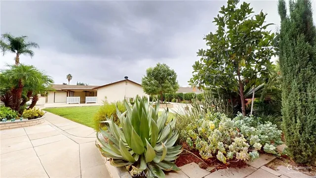 an aerial view of a house with yard swimming pool and outdoor seating
