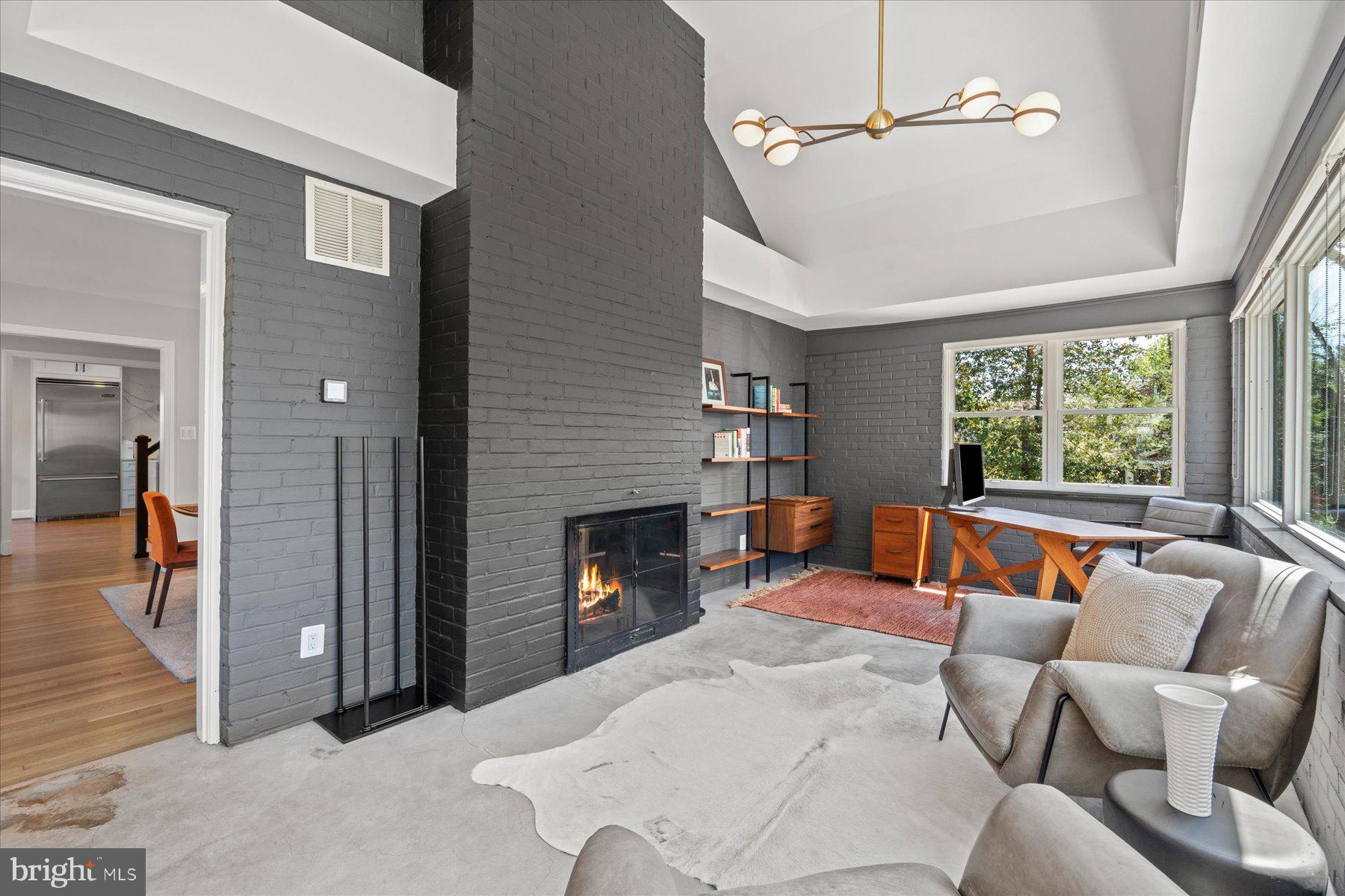 5612 Overlea Road Bethesda, MD 20816 - Photo 16 of 55 With the back of the double sided fireplace