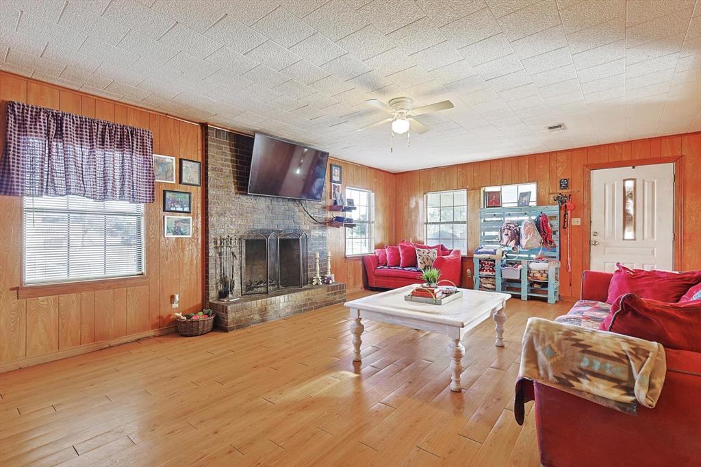 491 Emily Lane Van Alstyne, TX 75495 - Photo 3 of 21 a living room with furniture and a fireplace