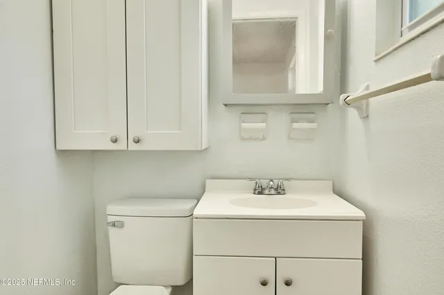 a bathroom with a sink and a vanity