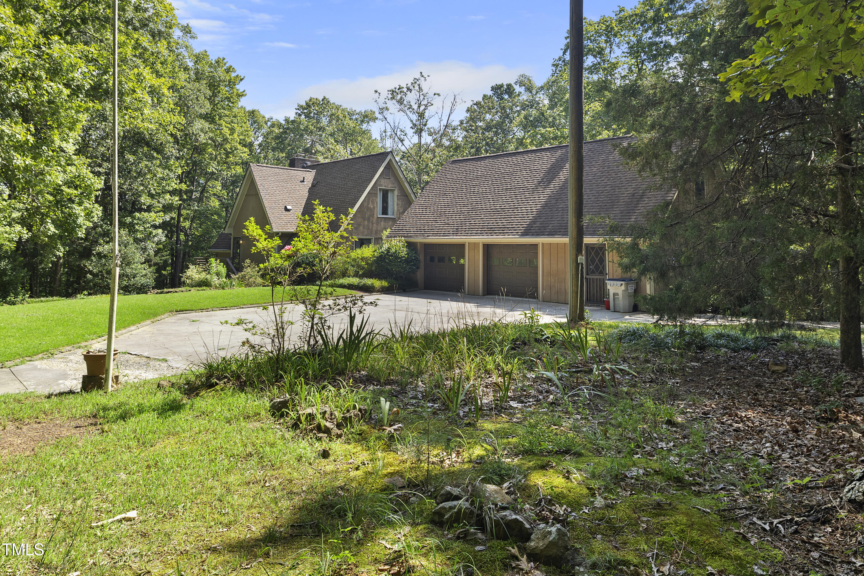 73 Hilltop Road Sanford, NC 27330 - Photo 7 of 54 a view of a house with a big yard and potted plants