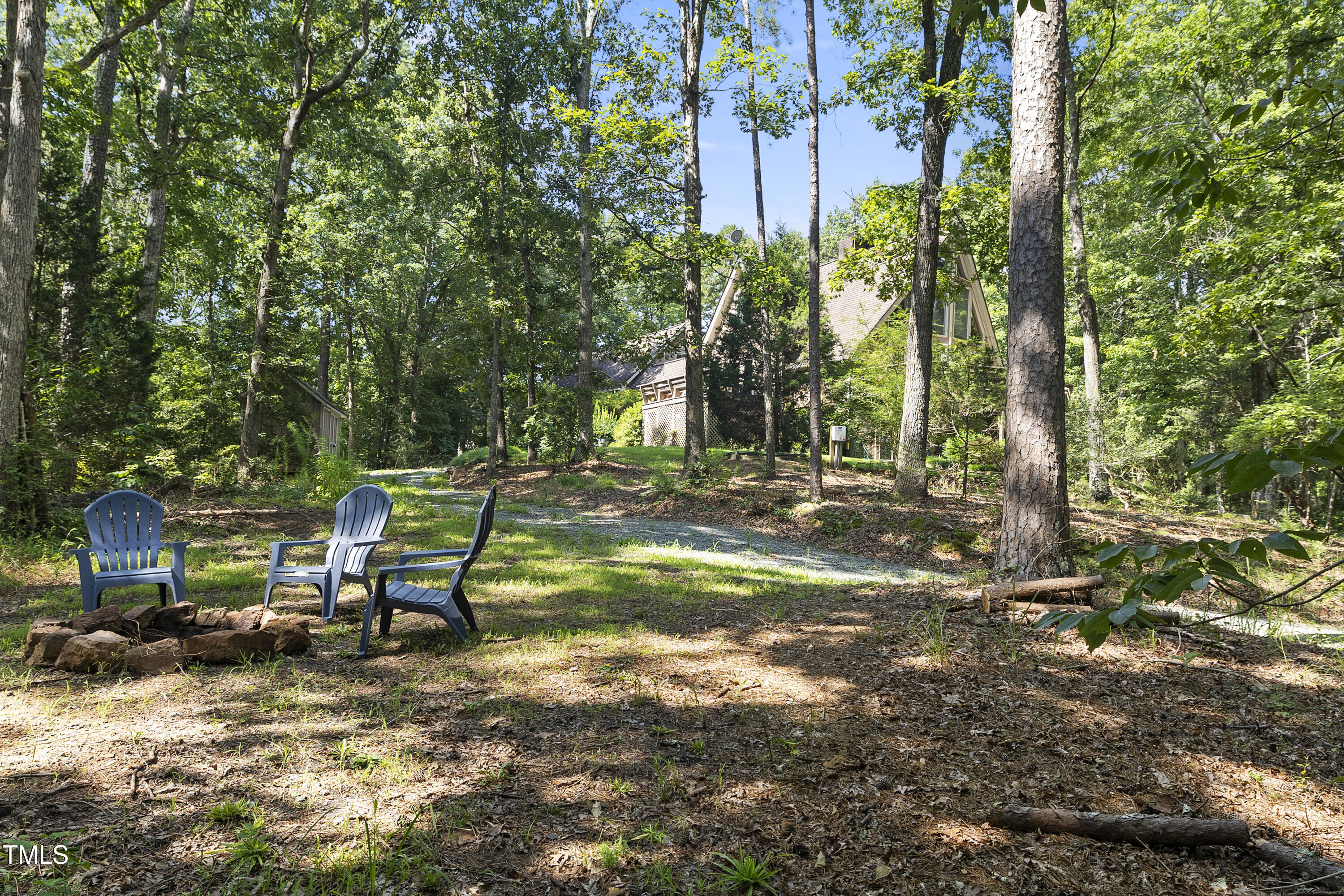 73 Hilltop Road Sanford, NC 27330 - Photo 9 of 54 a view of backyard with a table and chairs