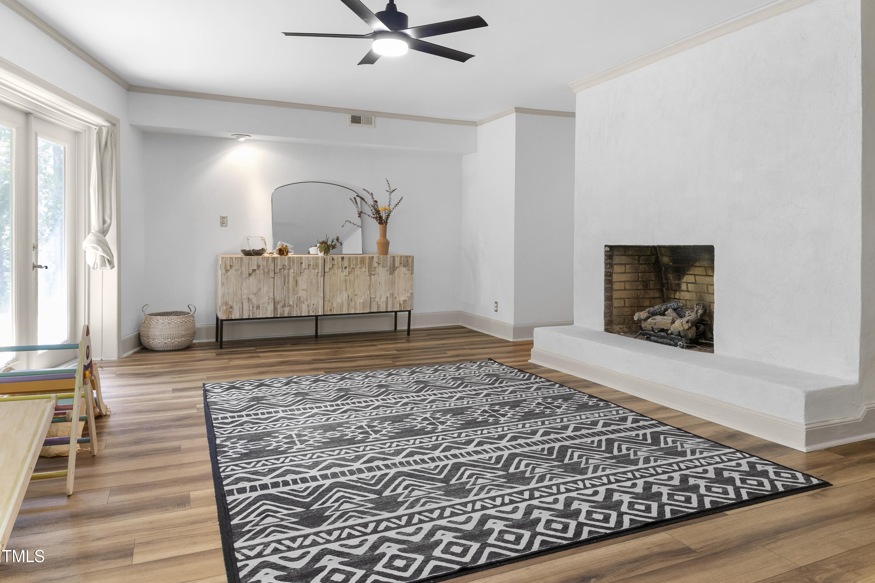 73 Hilltop Road Sanford, NC 27330 - Photo 12 of 54 a living room with a couch and a rug