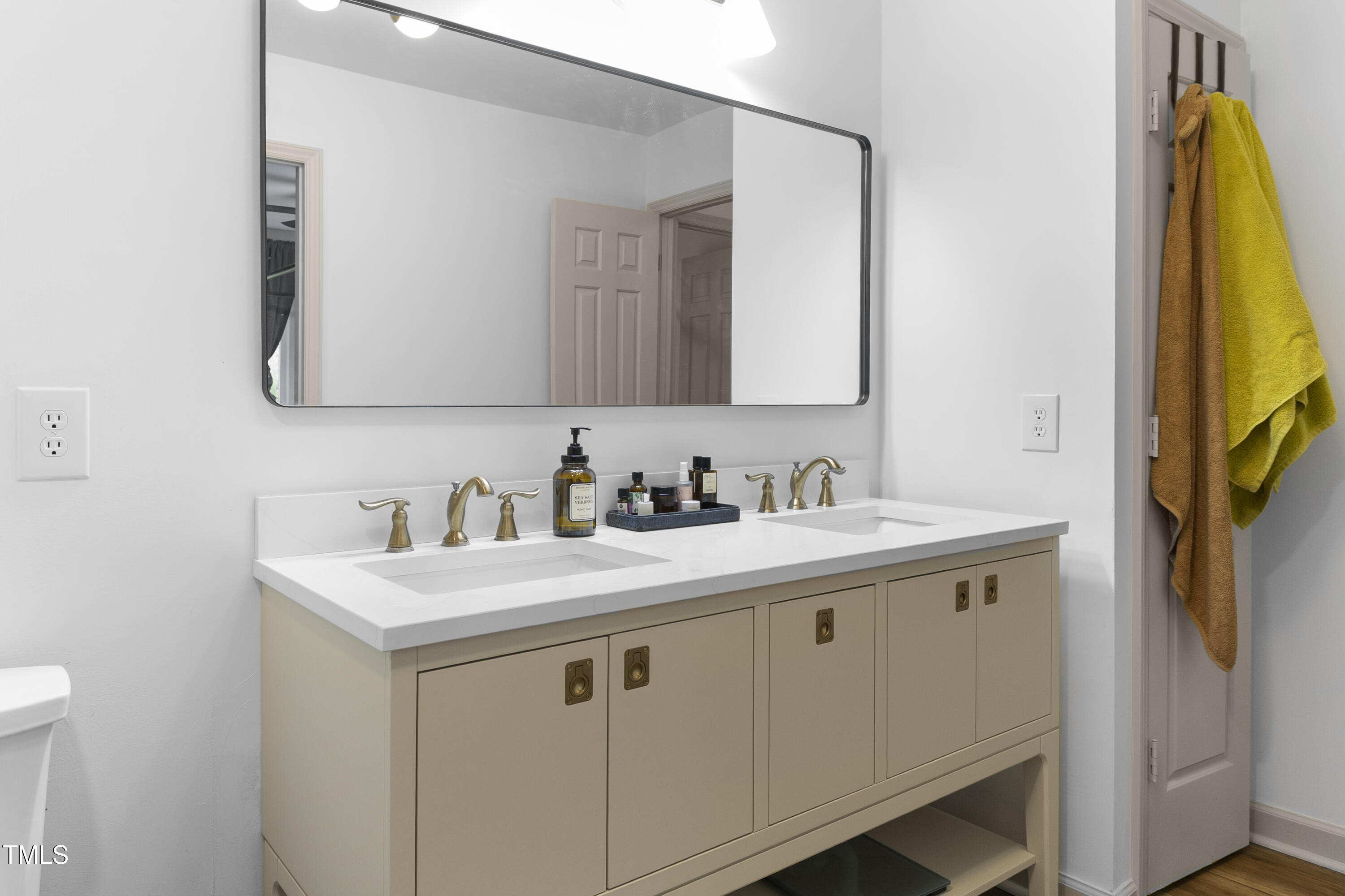 73 Hilltop Road Sanford, NC 27330 - Photo 13 of 54 a bathroom with a sink and a mirror