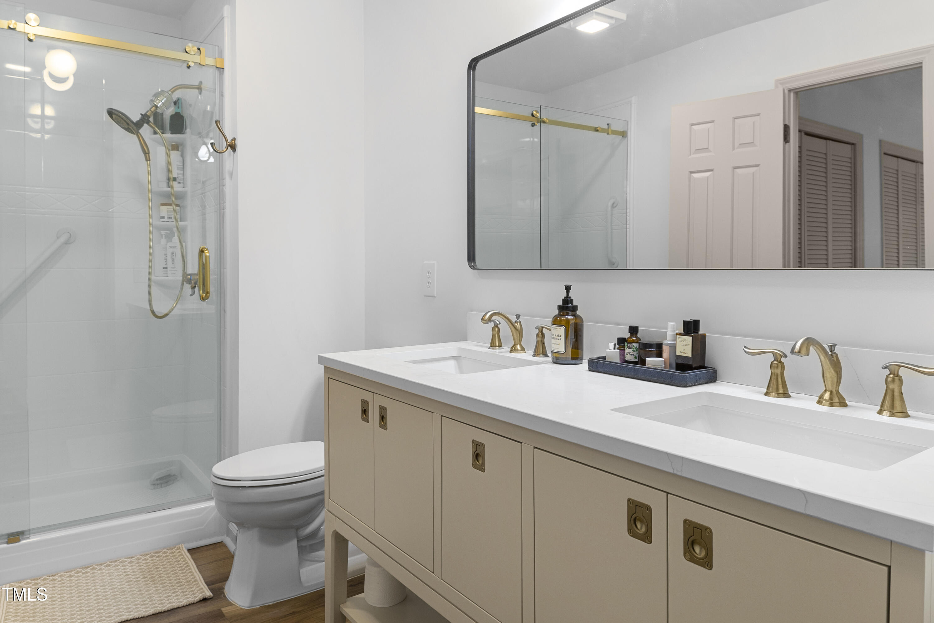 73 Hilltop Road Sanford, NC 27330 - Photo 14 of 54 a bathroom with a granite countertop sink a toilet and a mirror