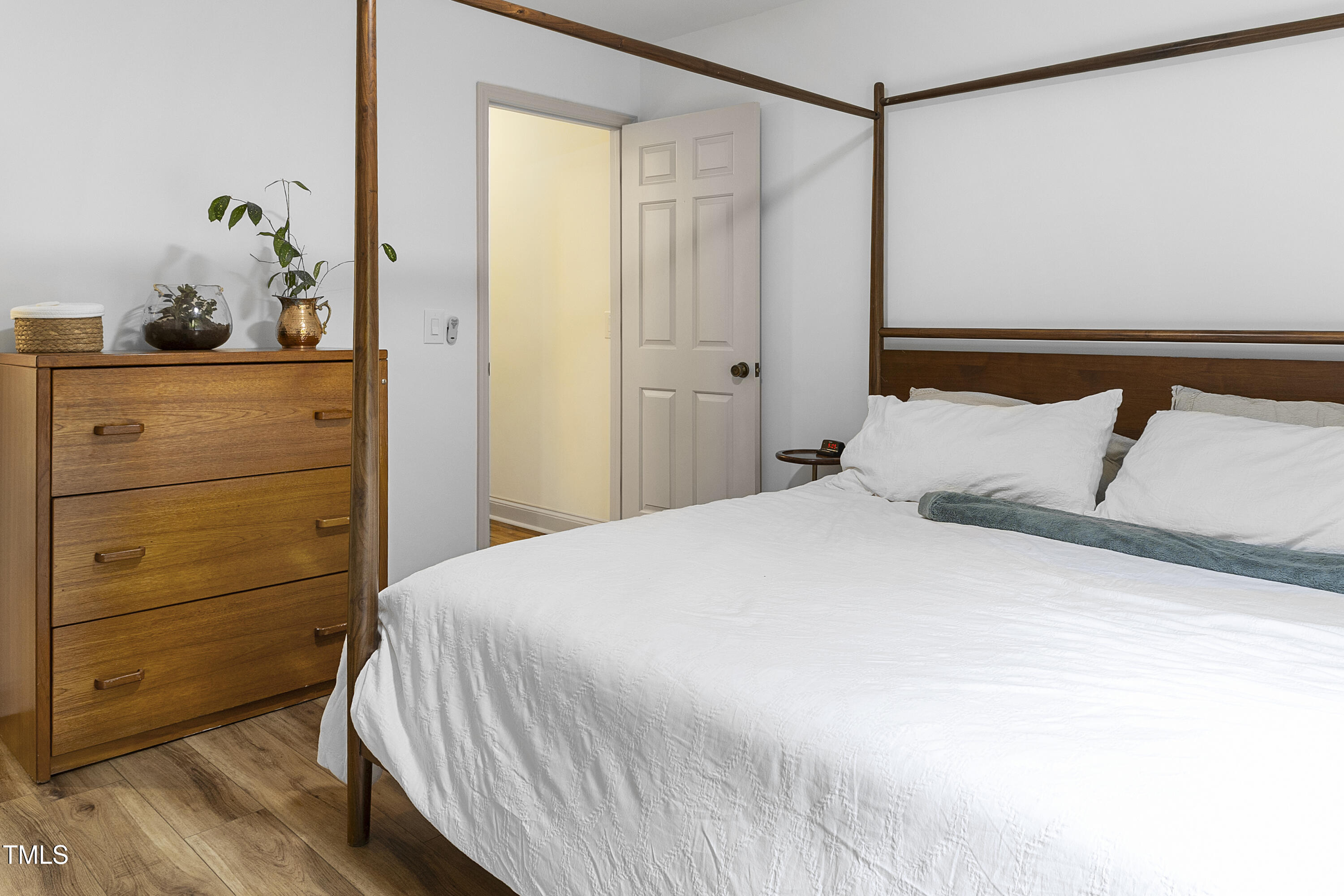 73 Hilltop Road Sanford, NC 27330 - Photo 19 of 54 a bedroom with a bed and a dresser in it