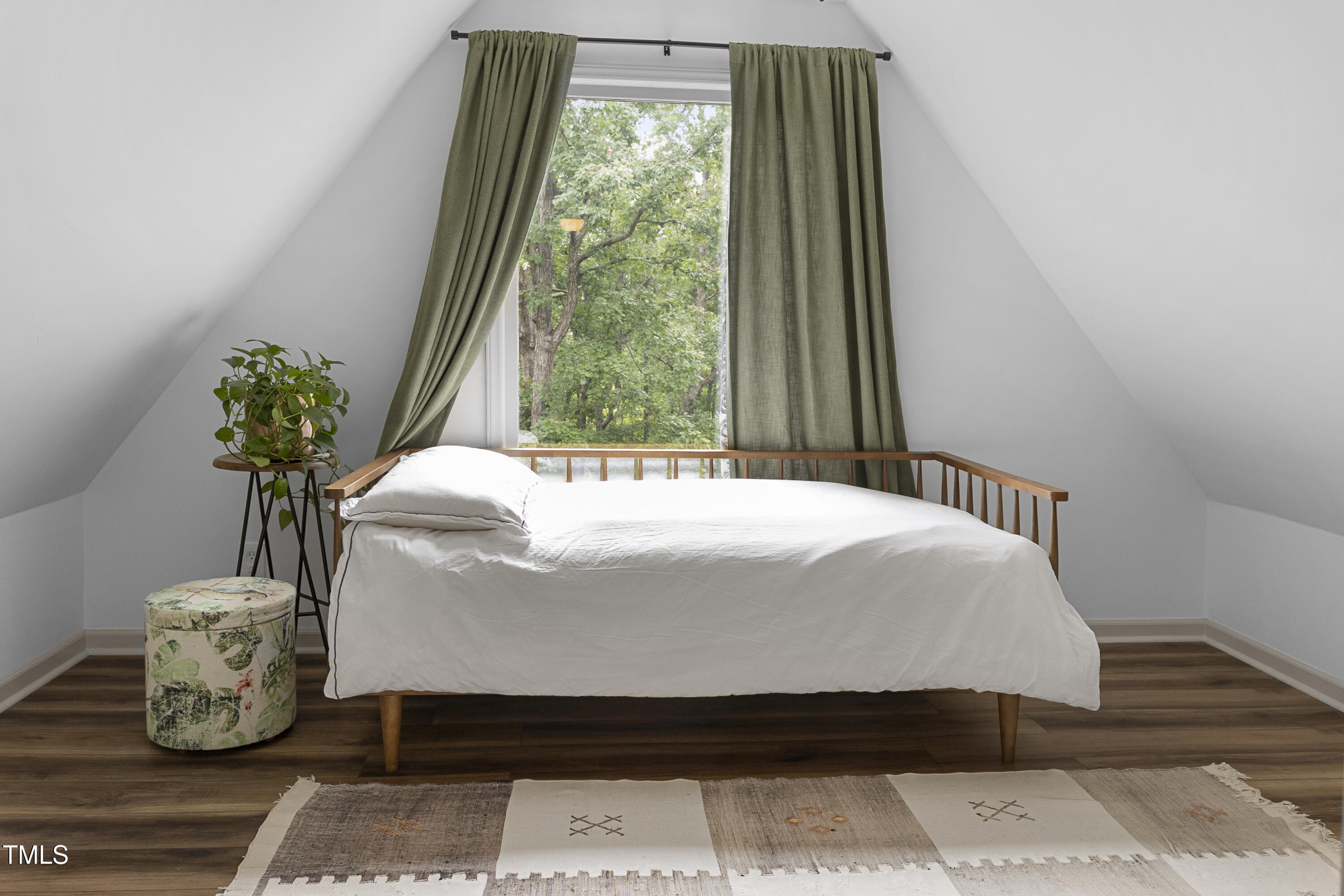 73 Hilltop Road Sanford, NC 27330 - Photo 20 of 54 a bed sitting in a bedroom next to a window