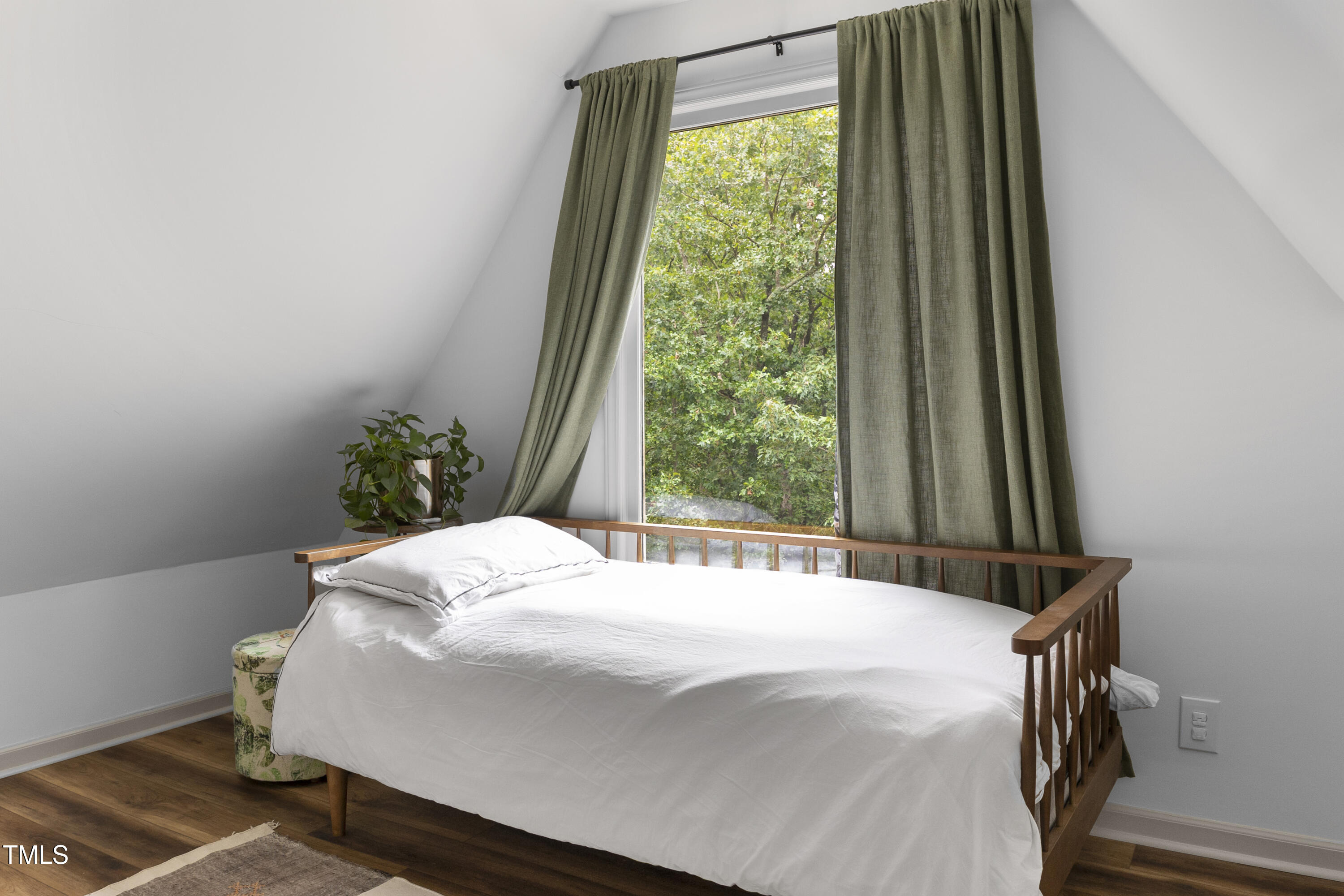 73 Hilltop Road Sanford, NC 27330 - Photo 21 of 54 a bed sitting in a bedroom next to a window