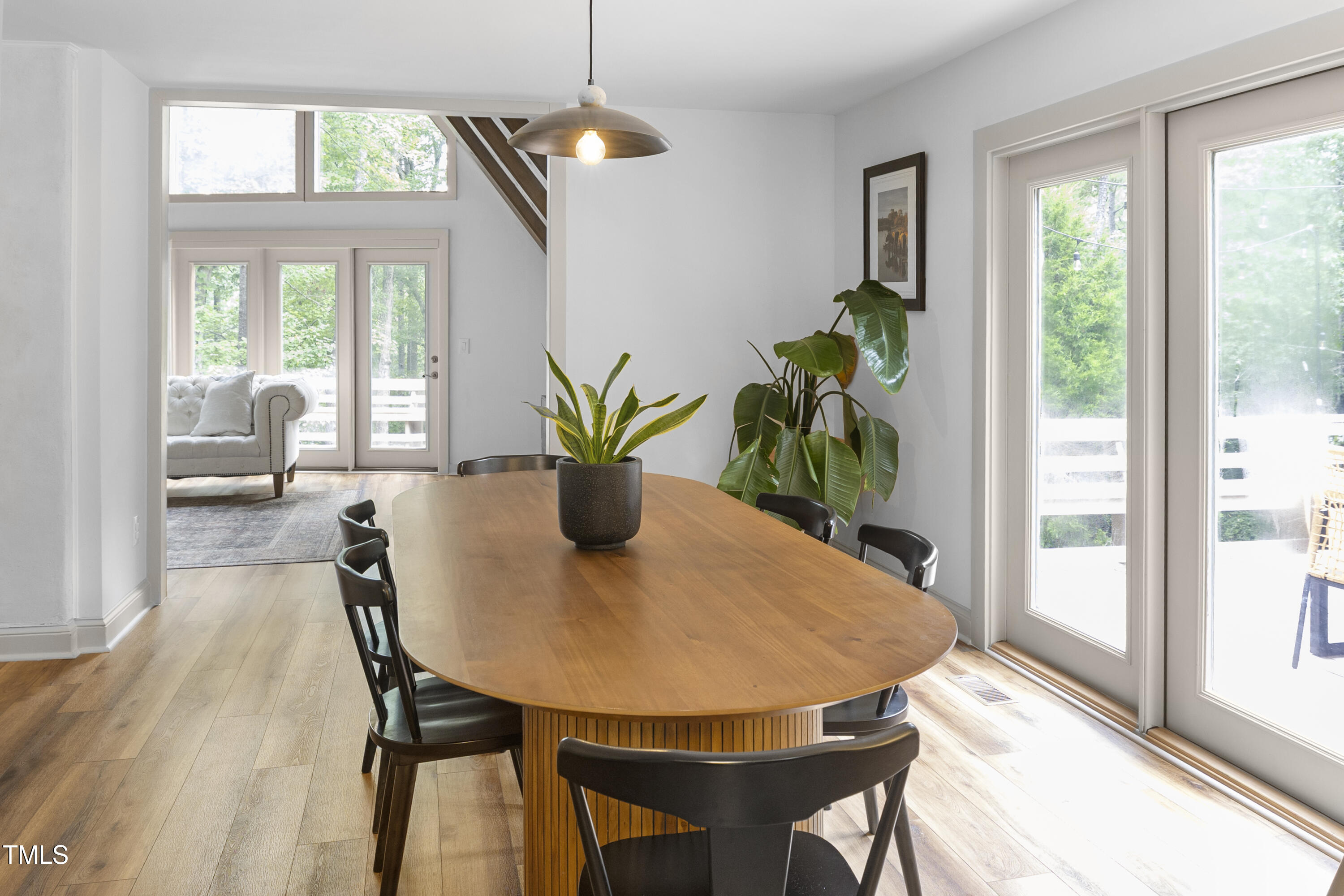 73 Hilltop Road Sanford, NC 27330 - Photo 25 of 54 a view of a dining room with furniture and a potted plant