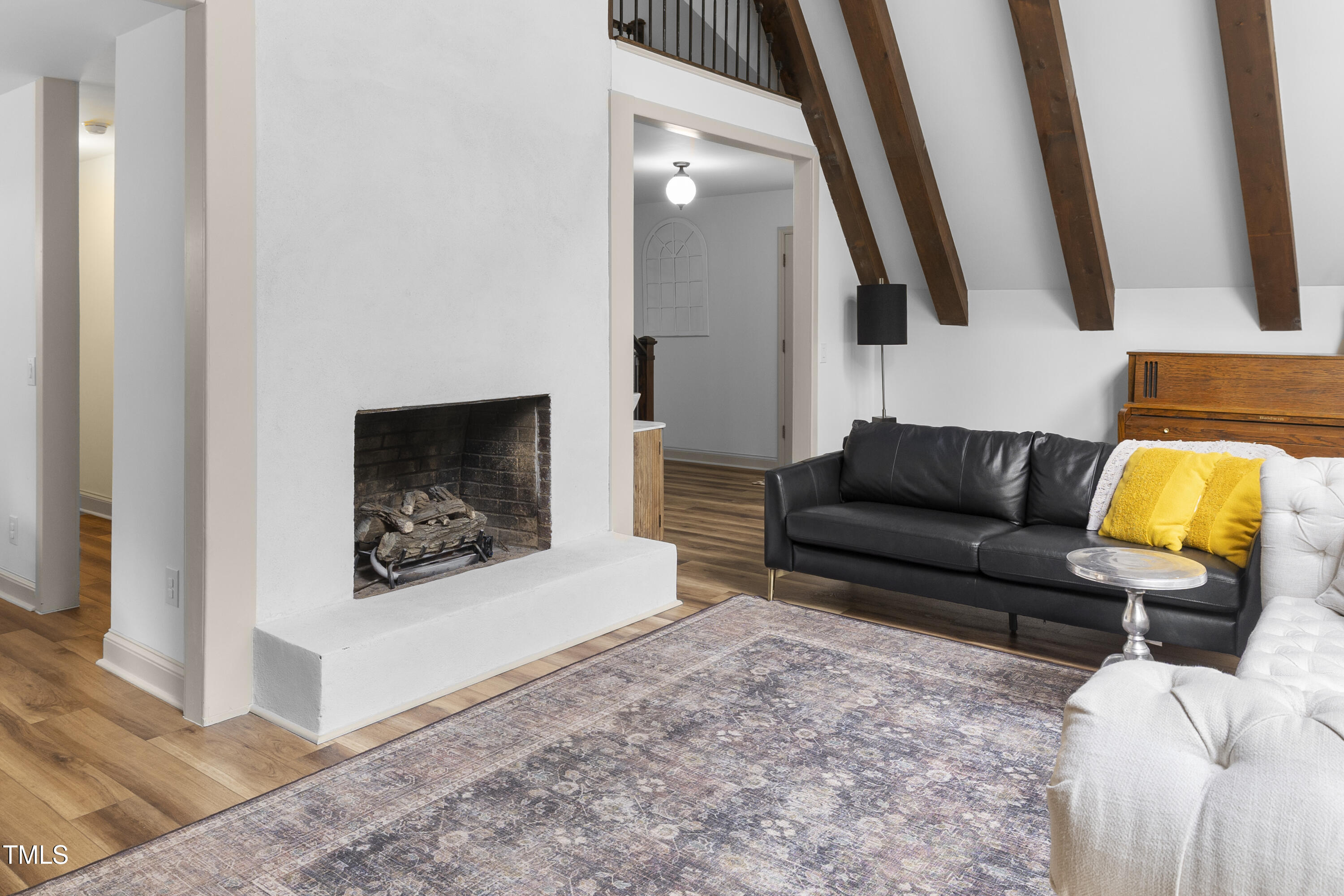 73 Hilltop Road Sanford, NC 27330 - Photo 34 of 54 a living room with furniture and a fireplace
