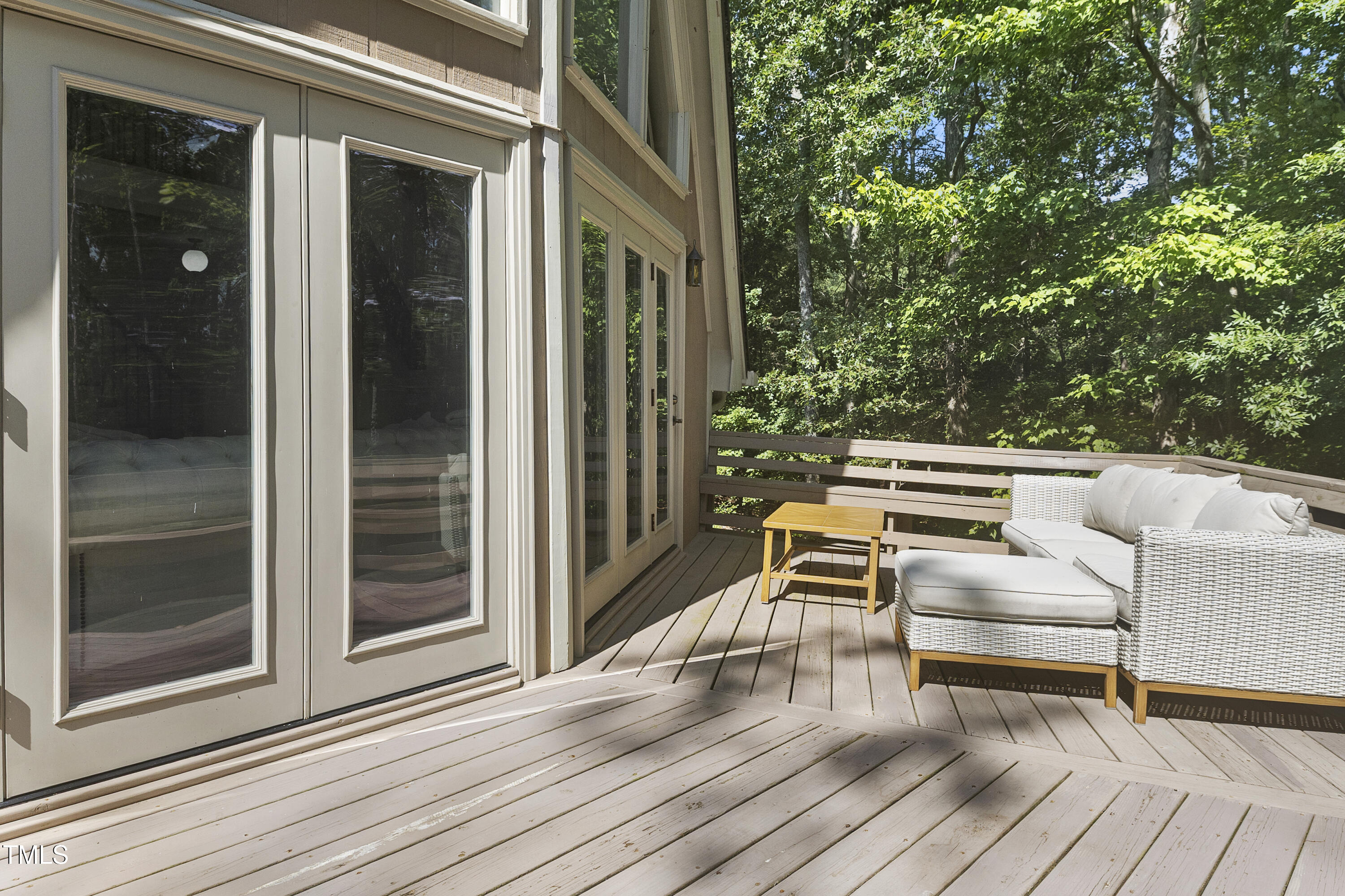 73 Hilltop Road Sanford, NC 27330 - Photo 37 of 54 a view of a patio with dining table and chairs with wooden floor and fence