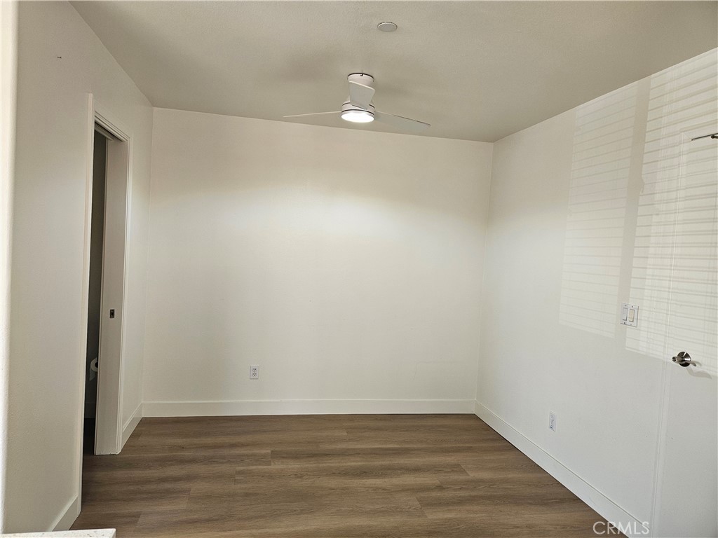8598 Belmont Street Cypress, CA 90630 - Photo 11 of 23 a view of an empty room with wooden floor