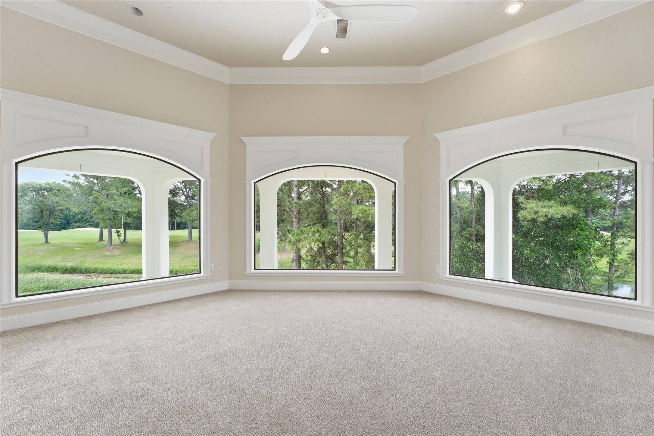 70 Quail Rock Place The Woodlands, TX 77381 - Photo 27 of 46 an empty room with windows view and outdoor space