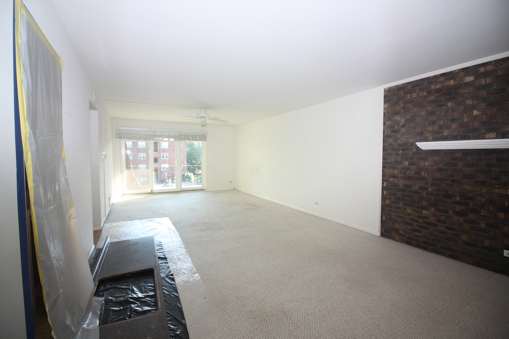 475 Shenstone Road, Unit 303 Riverside, IL 60546 - Photo 2 of 12 a view of livingroom with furniture and window