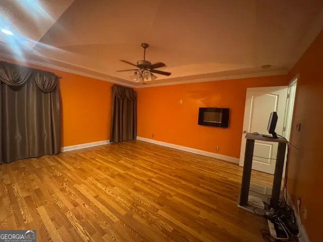 a view of a livingroom with wooden floor