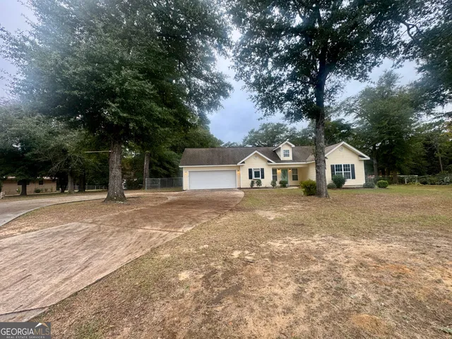 a house with trees in the background