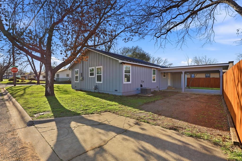 502 Madison Street Cleburne, TX 76033 - Photo 24 of 30 a view of a house with a yard