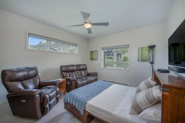 a bedroom with bed and window