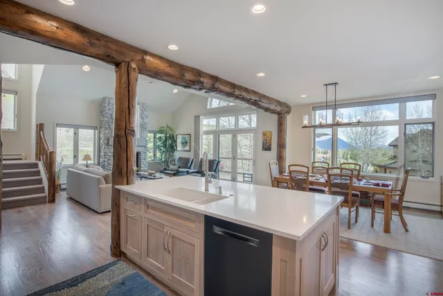 a kitchen with center island and windows