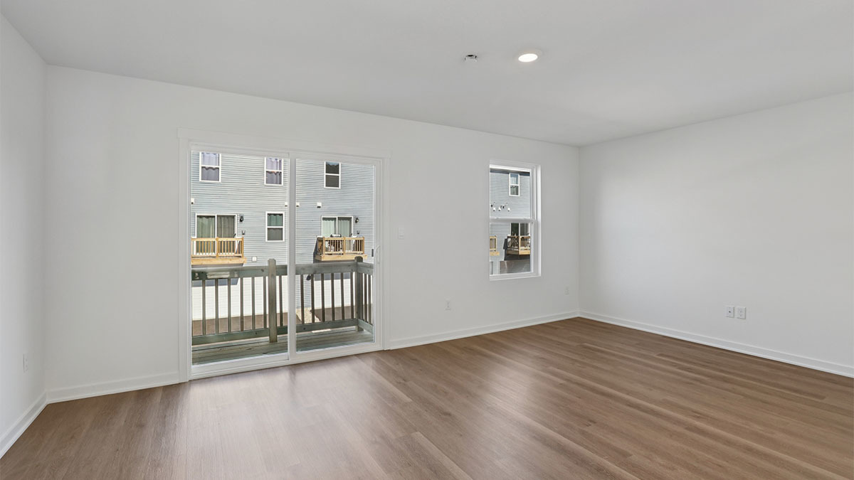 1397 Oakfield Lane Pingree Grove, IL 60140 - Photo 11 of 49 a view of a big room with wooden floor and windows