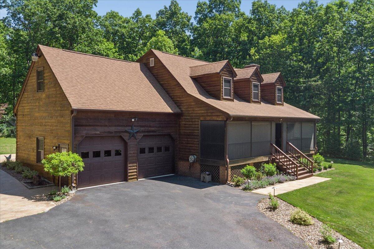 431 Langdon Road Evington, VA 24550 - Photo 2 of 54 a front view of a house with a yard and garage