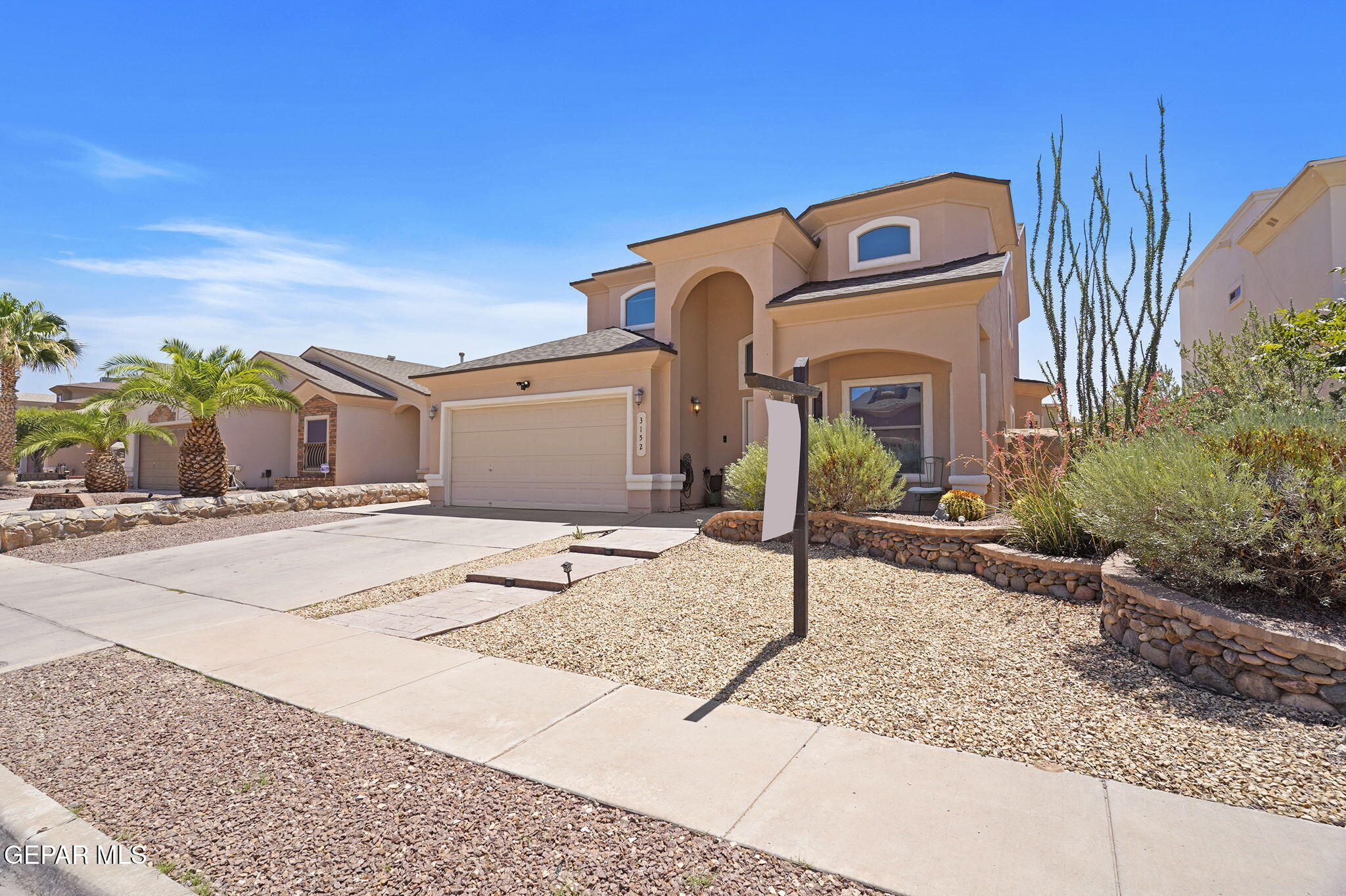 3152 Rustic Hidden Drive El Paso, TX 79938 - Photo 4 of 38 a front view of a house with street