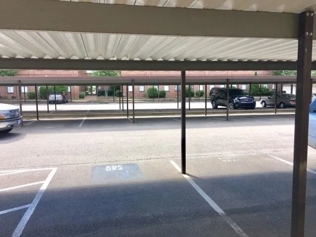 a view of a swimming pool with an outdoor seating