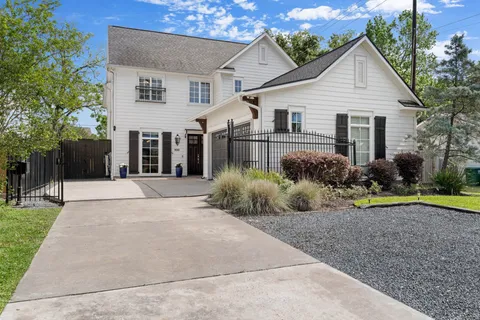 a view of a house with a swimming pool and porch