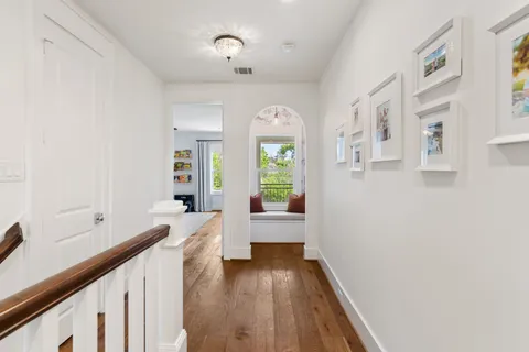 a spacious bedroom with a large bed and a couch