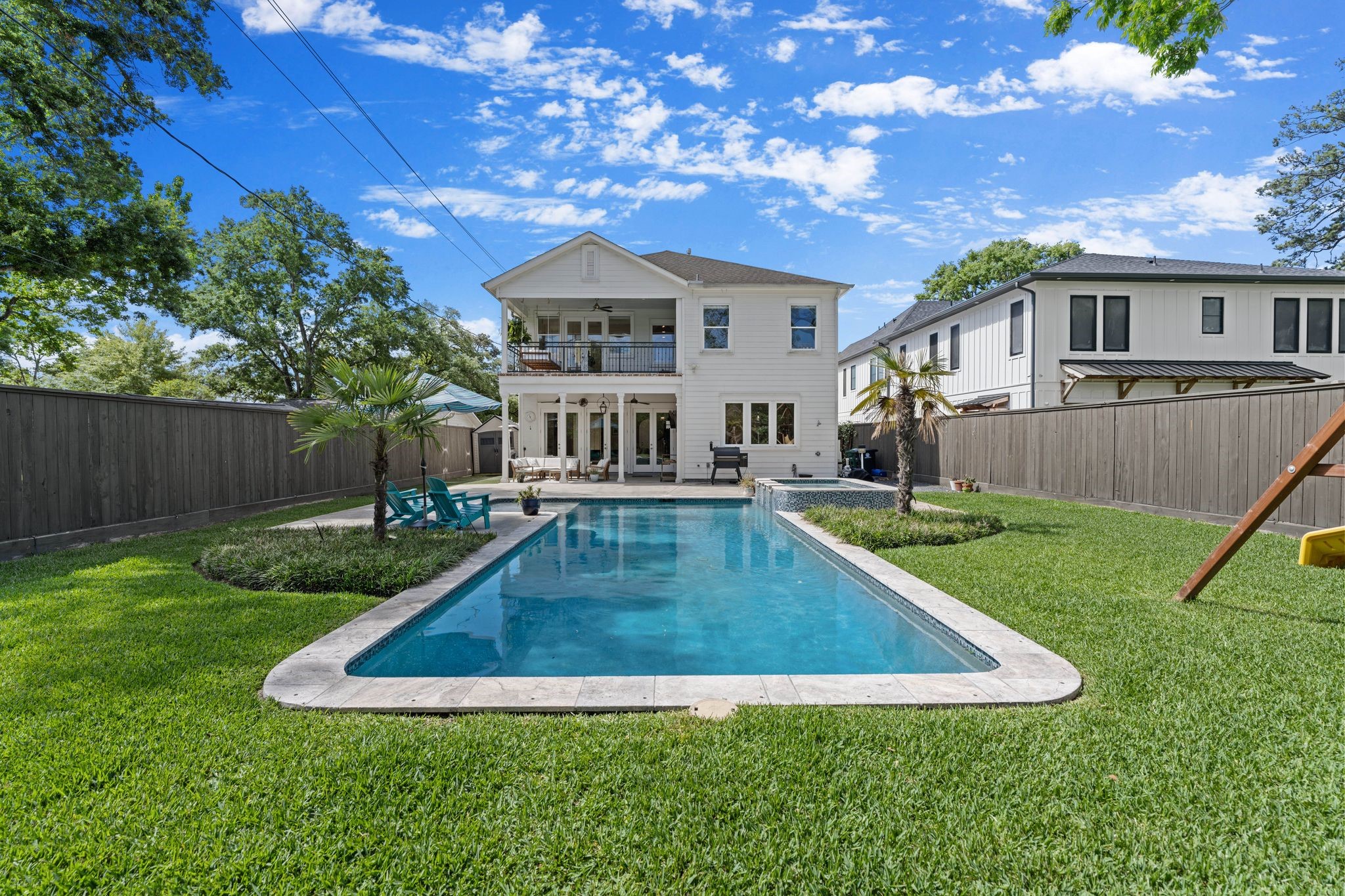 930 West 43rd Street Houston, TX 77018 - Photo 2 of 39 a view of a house with a swimming pool and porch
